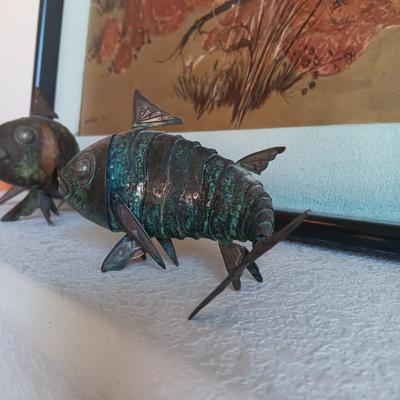 2 METAL FISH THAT ARE HINGED TO GIVE THE APPEARANCE OF MOVING