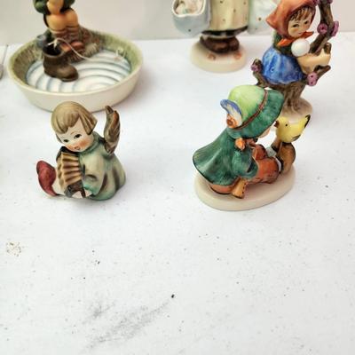 Collection of 11 Goebel Hummels Figurines Skier Boy Fishing Angle