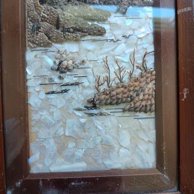 PICTURE MADE FROM SEA SHELLS AND AN ASIAN THEMED FIGURINE