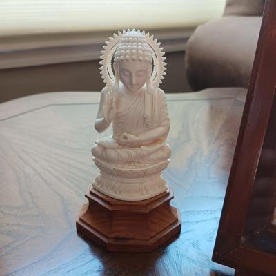 PICTURE MADE FROM SEA SHELLS AND AN ASIAN THEMED FIGURINE