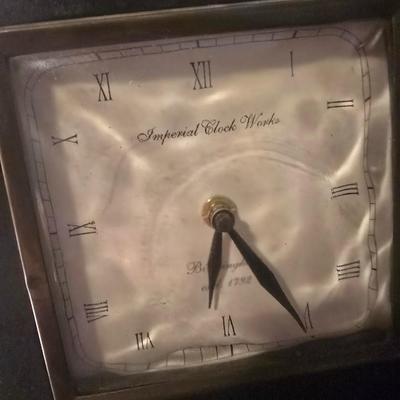 IMPERIAL CLOCK WORKS BOOK ENDS THAT ARE BATTERY OPERATED CLOCKS