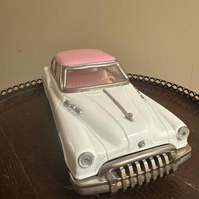 Old toy car Vintage Tin Friction Oldsmobile Promo car with pink roof/white body