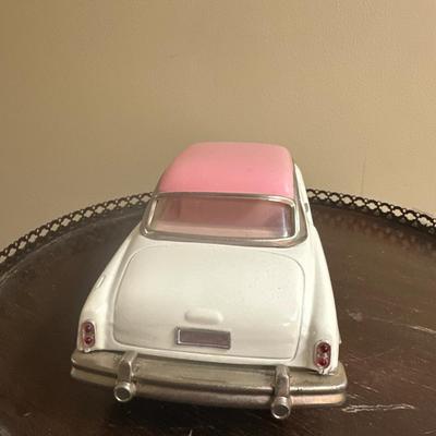 Old toy car Vintage Tin Friction Oldsmobile Promo car with pink roof/white body