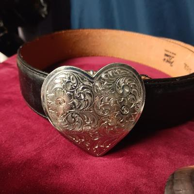 SILVER PLATED BELT BUCKLE ON A TONY LAMA' LEATHER BELT AND