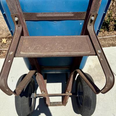 Sale Photo Thumbnail #510: Hard poly plastic 10 cubic foot bucket that doesn't rust.  Solid handles, 2 wheels, pneumatic tires hold air. Overall good used condition. Excellent for gardening, soil movement, or tasks involving wet things.