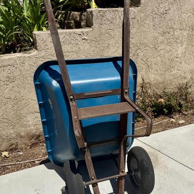 Sale Photo Thumbnail #509: Hard poly plastic 10 cubic foot bucket that doesn't rust.  Solid handles, 2 wheels, pneumatic tires hold air. Overall good used condition. Excellent for gardening, soil movement, or tasks involving wet things.