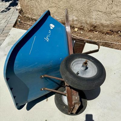 Sale Photo Thumbnail #512: Hard poly plastic 10 cubic foot bucket that doesn't rust.  Solid handles, 2 wheels, pneumatic tires hold air. Overall good used condition. Excellent for gardening, soil movement, or tasks involving wet things.