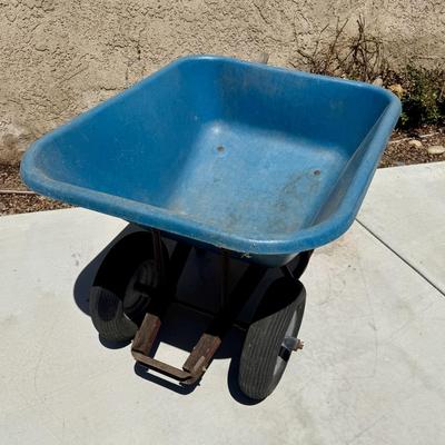Sale Photo Thumbnail #508: Hard poly plastic 10 cubic foot bucket that doesn't rust.  Solid handles, 2 wheels, pneumatic tires hold air. Overall good used condition. Excellent for gardening, soil movement, or tasks involving wet things.
