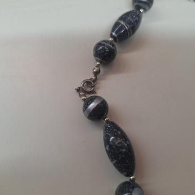 2 necklaces and a watch
