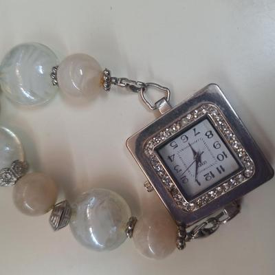 2 necklaces and a watch