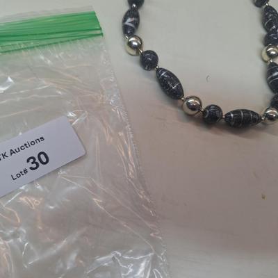 2 necklaces and a watch