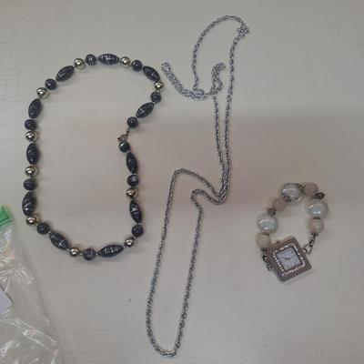 2 necklaces and a watch
