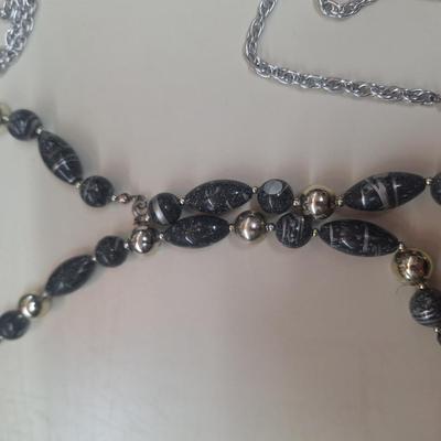 2 necklaces and a watch