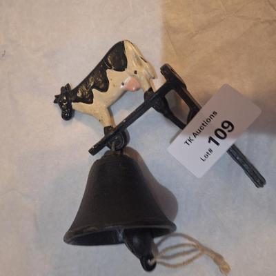 Cast iron bell with cow on top