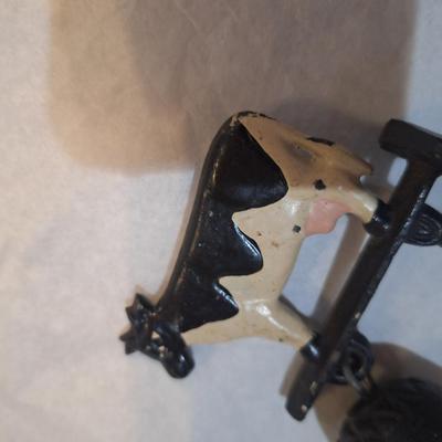 Cast iron bell with cow on top
