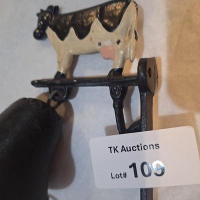 Cast iron bell with cow on top