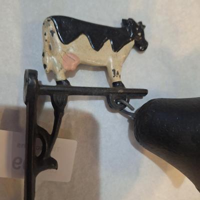 Cast iron bell with cow on top