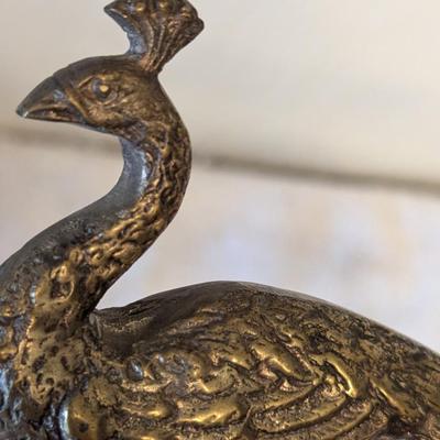 Brass peacocks