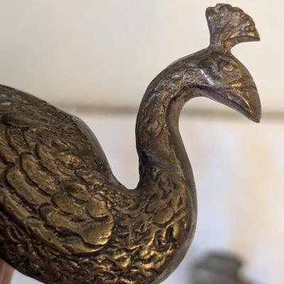 Brass peacocks