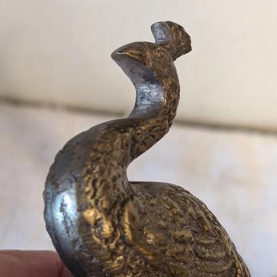 Brass peacocks