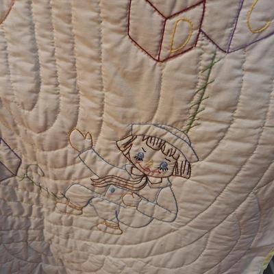 small embroidered quilt