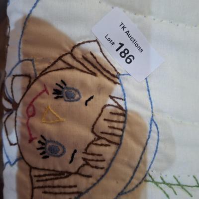 small embroidered quilt