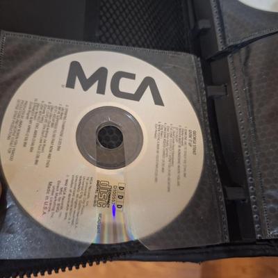 CD case with some CDs