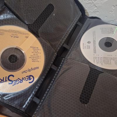 CD case with some CDs