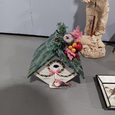 RESIN BOY HOLDING A LANTERN YARD ART AND SOME BIRD HOUSES