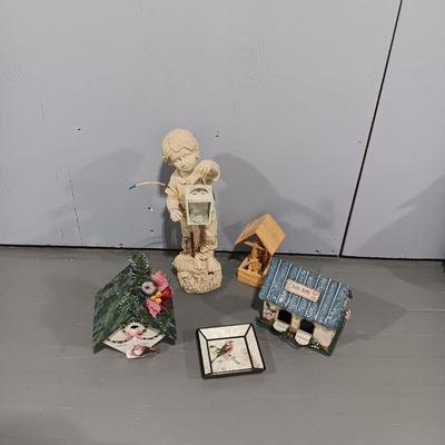 RESIN BOY HOLDING A LANTERN YARD ART AND SOME BIRD HOUSES