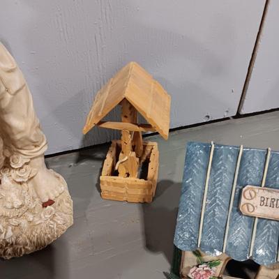 RESIN BOY HOLDING A LANTERN YARD ART AND SOME BIRD HOUSES