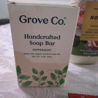 Sale Photo Thumbnail #58: 4 bars Ivory soap, hand sanitizer with purse hanger, Grove Co. Handcrafted soap bar-peppermint, Rose body lotion by Bath & Body Works, 2 tubes hand cream, green tea body wash
