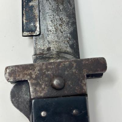 Sale Photo Thumbnail #309: Original WWII US Pilot's folding survival machete.
Overall length 15 1/2”