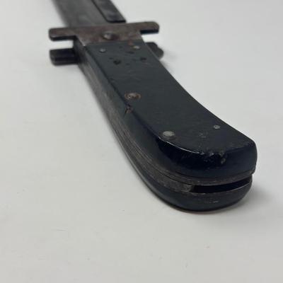 Sale Photo Thumbnail #310: Original WWII US Pilot's folding survival machete.
Overall length 15 1/2”
