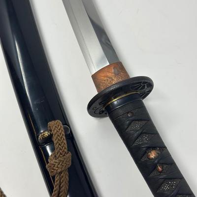 Sale Photo Thumbnail #315: Hand forged, traditionally made Japanese sword. Its name refers to the practice of wearing the sword through an obi or sash at one's side.
Overall length 24”