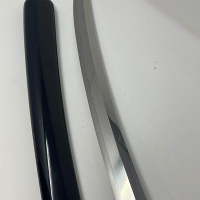 Sale Photo Thumbnail #316: Hand forged, traditionally made Japanese sword. Its name refers to the practice of wearing the sword through an obi or sash at one's side.
Overall length 24”