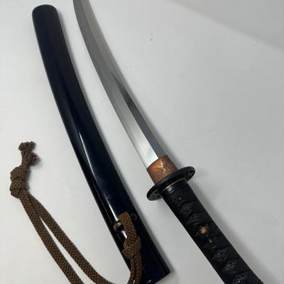 Sale Photo Thumbnail #313: Hand forged, traditionally made Japanese sword. Its name refers to the practice of wearing the sword through an obi or sash at one's side.
Overall length 24”