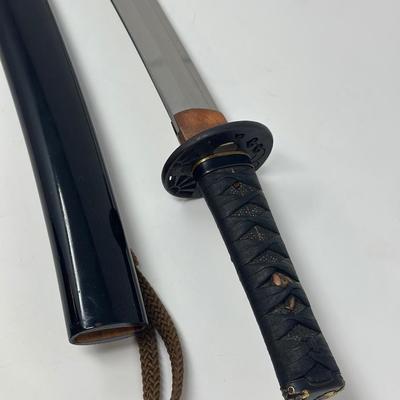 Sale Photo Thumbnail #317: Hand forged, traditionally made Japanese sword. Its name refers to the practice of wearing the sword through an obi or sash at one's side.
Overall length 24”