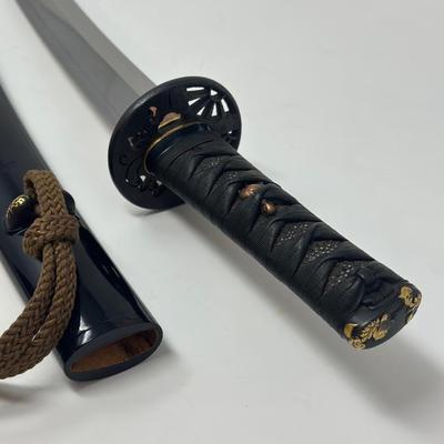 Sale Photo Thumbnail #314: Hand forged, traditionally made Japanese sword. Its name refers to the practice of wearing the sword through an obi or sash at one's side.
Overall length 24”