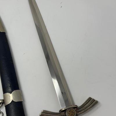 Sale Photo Thumbnail #331: Stamped Albert Kuhl, Munster I/W Essen. This WWII German Luftwaffe dagger has two swastikas depicted on the hilt.