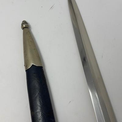 Sale Photo Thumbnail #329: Stamped Albert Kuhl, Munster I/W Essen. This WWII German Luftwaffe dagger has two swastikas depicted on the hilt.