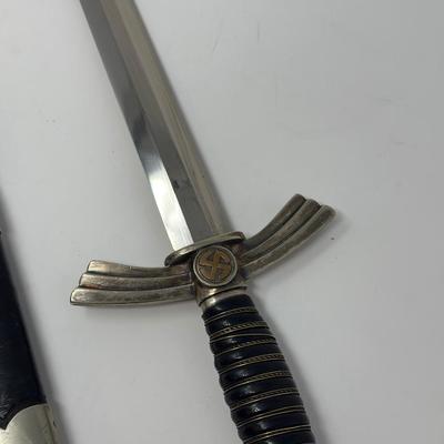Sale Photo Thumbnail #330: Stamped Albert Kuhl, Munster I/W Essen. This WWII German Luftwaffe dagger has two swastikas depicted on the hilt.