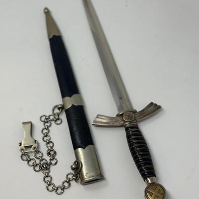 Sale Photo Thumbnail #326: Stamped Albert Kuhl, Munster I/W Essen. This WWII German Luftwaffe dagger has two swastikas depicted on the hilt.