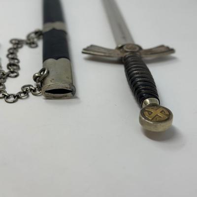 Sale Photo Thumbnail #333: Stamped Albert Kuhl, Munster I/W Essen. This WWII German Luftwaffe dagger has two swastikas depicted on the hilt.