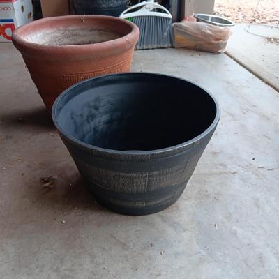 AN ASSORTMENT OF FLOWER POTS