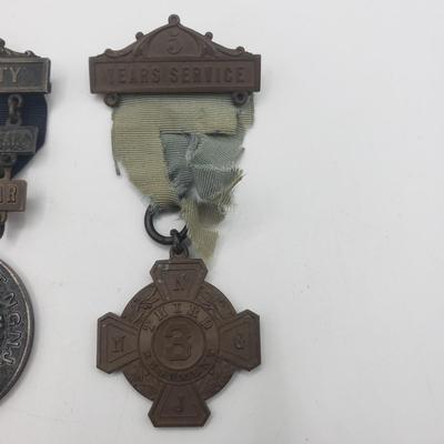 LOT 139F: Antique New Jersey National Guard Service Badges