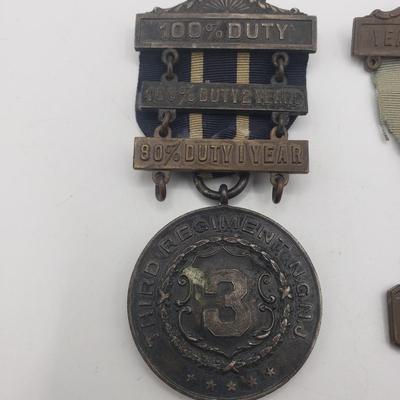 LOT 139F: Antique New Jersey National Guard Service Badges