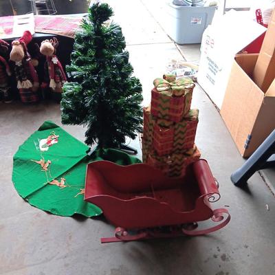 SMALL TREE WITH HANDMADE SKIRT, METAL SLEIGH AND LIGHTED FAKE PRESENTS