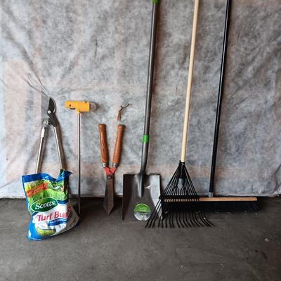 YARD TOOLS, PARTIAL BAG OF FERTILIZER AND A PUSH BROOM