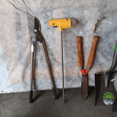 YARD TOOLS, PARTIAL BAG OF FERTILIZER AND A PUSH BROOM